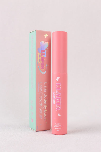 Pink lip balm with packaging on a light gray background