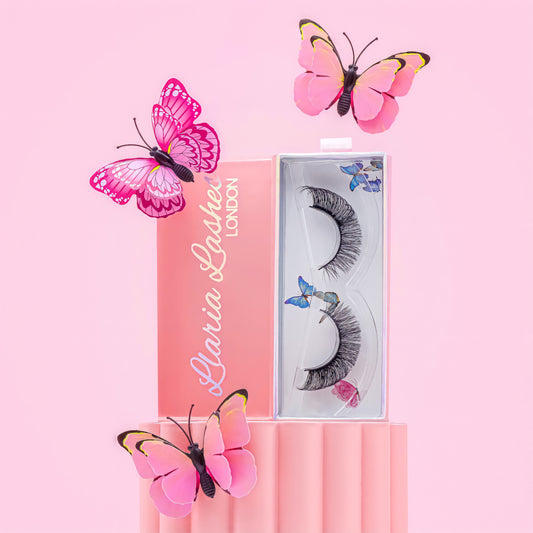 Eyelashes in a branded box with pink butterflies on a pink background