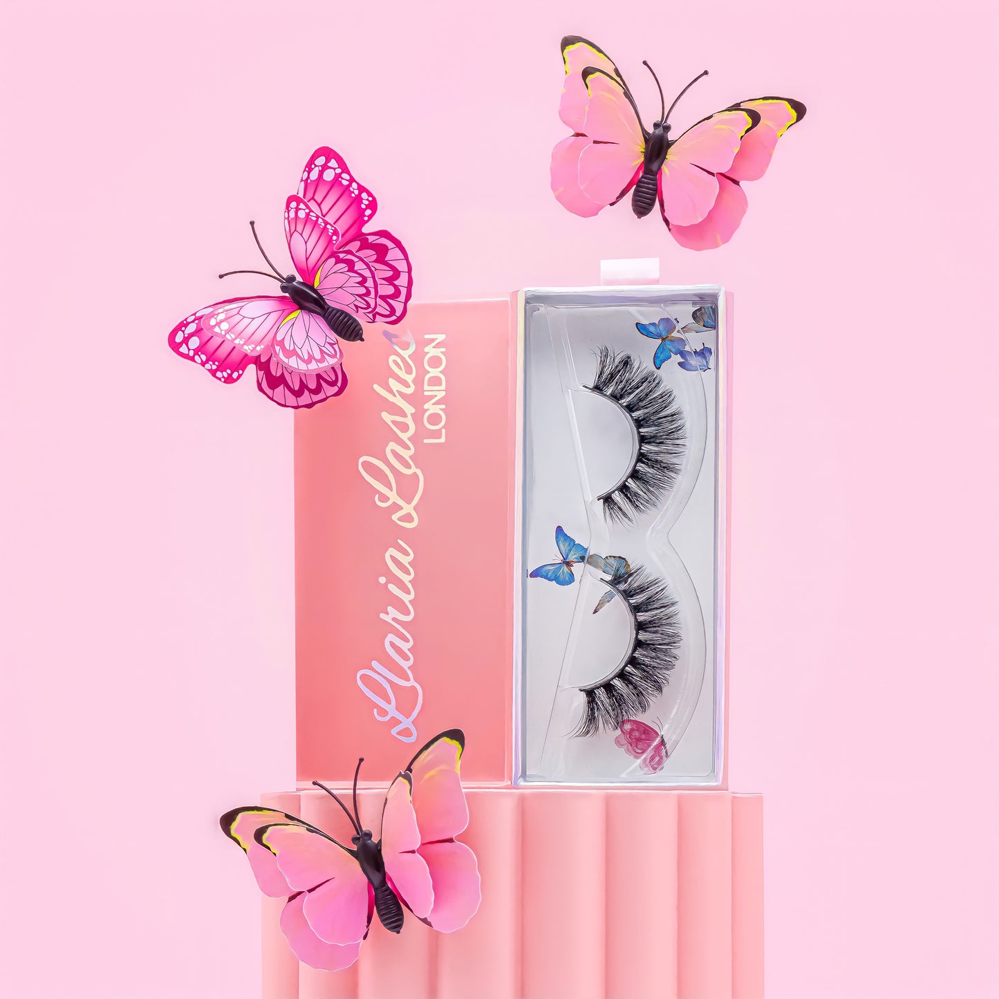 Eyelash packaging with decorative butterflies on a pink background