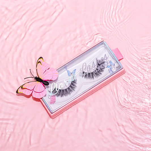 Eyelash packaging with a pink butterfly on a pink textured background