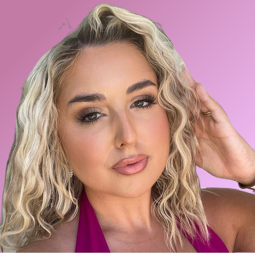 Woman with blonde hair and pink top against a pink background