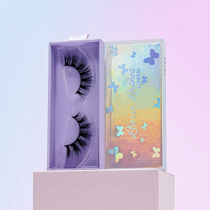 Eyelash packaging with a colorful butterfly design on a light purple background