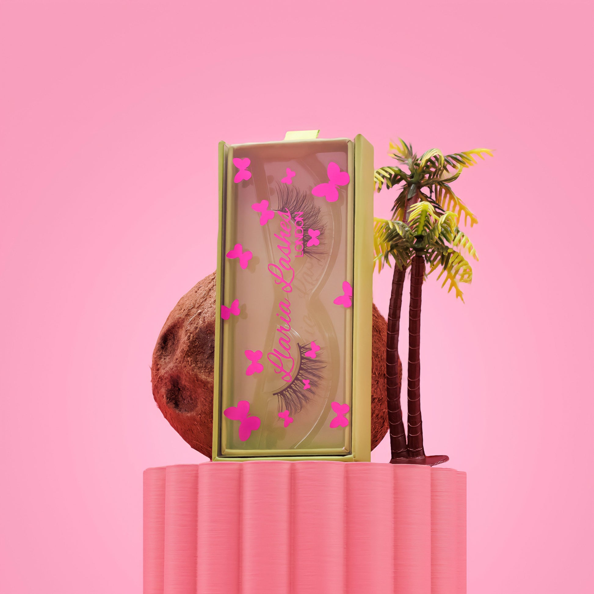 Makeup product with decorative elements on a pink background
