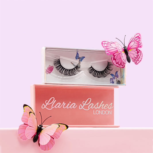 Llaria Lashes London packaging with butterfly decorations on a pink background